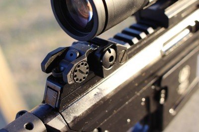 The rear sight folds neatly below a scope, and is there if you need it.