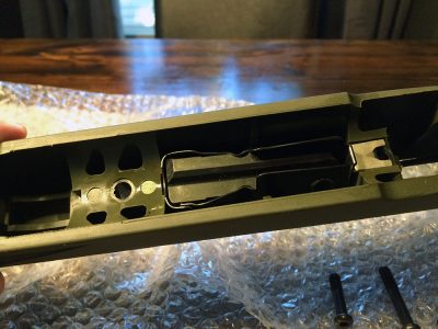 I admit I was baffled at first. There aren’t any screws, and I didn’t want to bend or break the magazine trying to pry it out. 