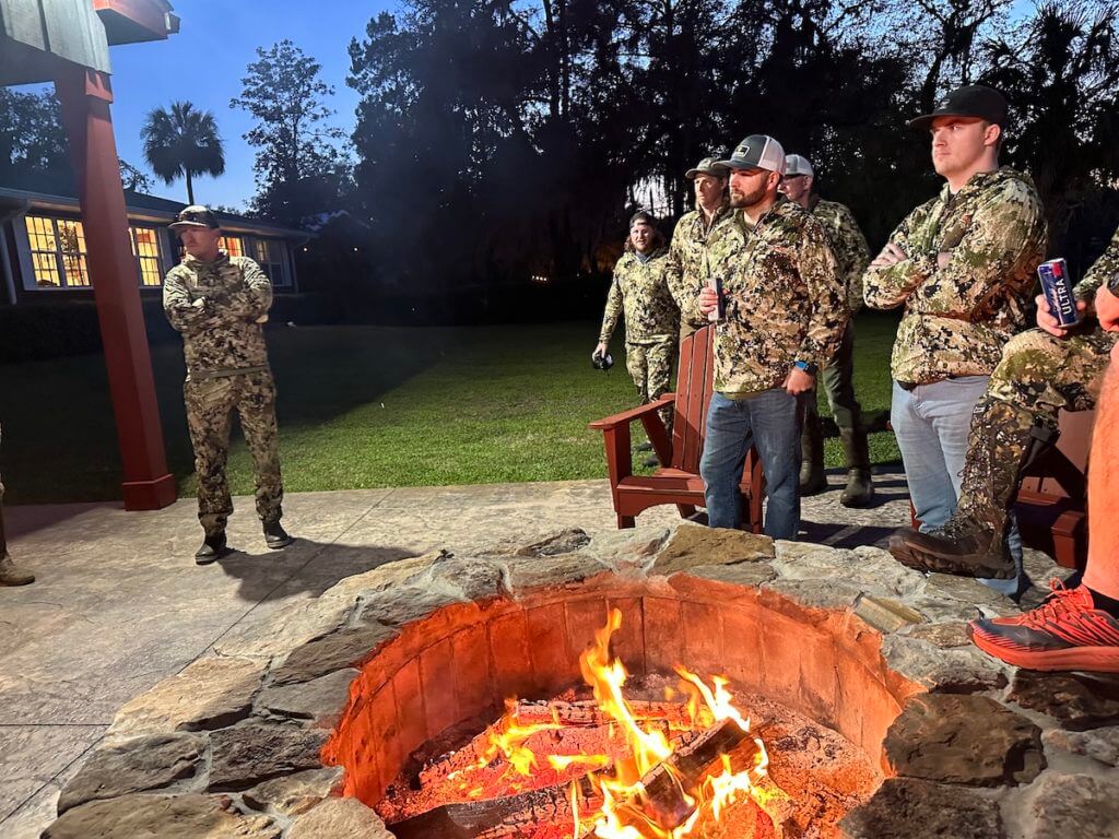 Hunters around a bonfire