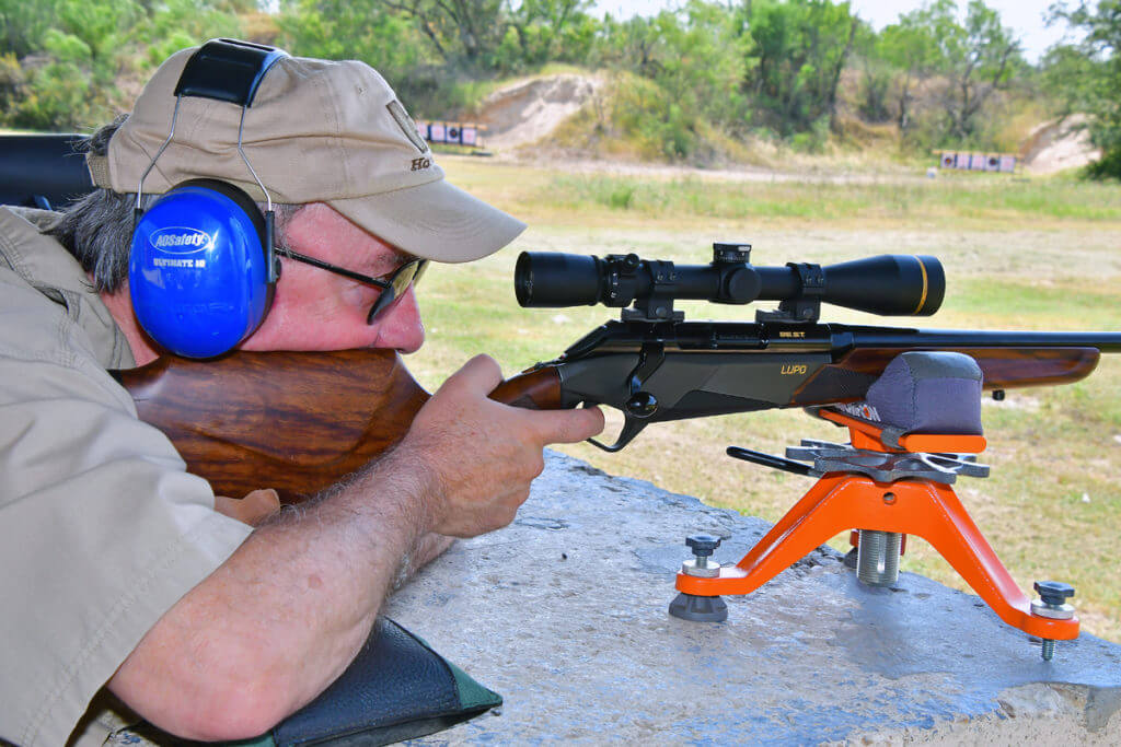 The author testing the Benelli Lupo BE.S.T. Walnut rifle, 6.5 Creedmoor