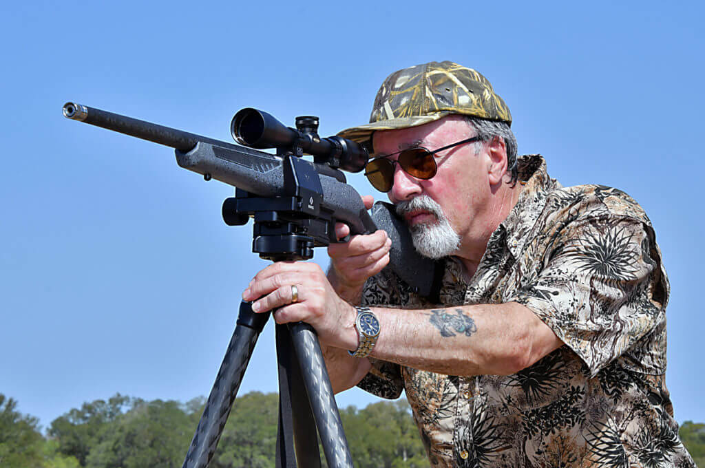 Author with Savage Model 110 Carbon Predator rifle with Weaver rifle scope and Really Right Stuff tripod.