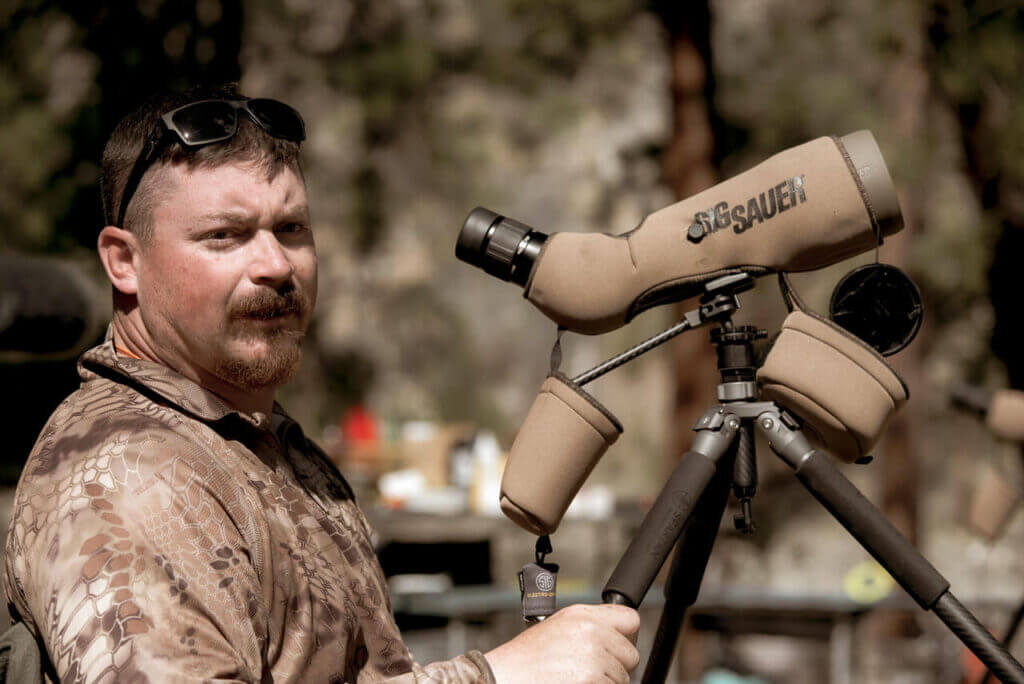 Hunter with spotting scope